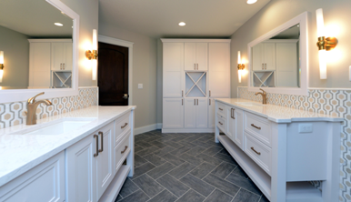 Bathroom with two vanities and custom white cabinetry